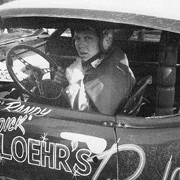 An old black and white photo of Randy Sweet in Dick Loehr's Mustang in the 1970s.