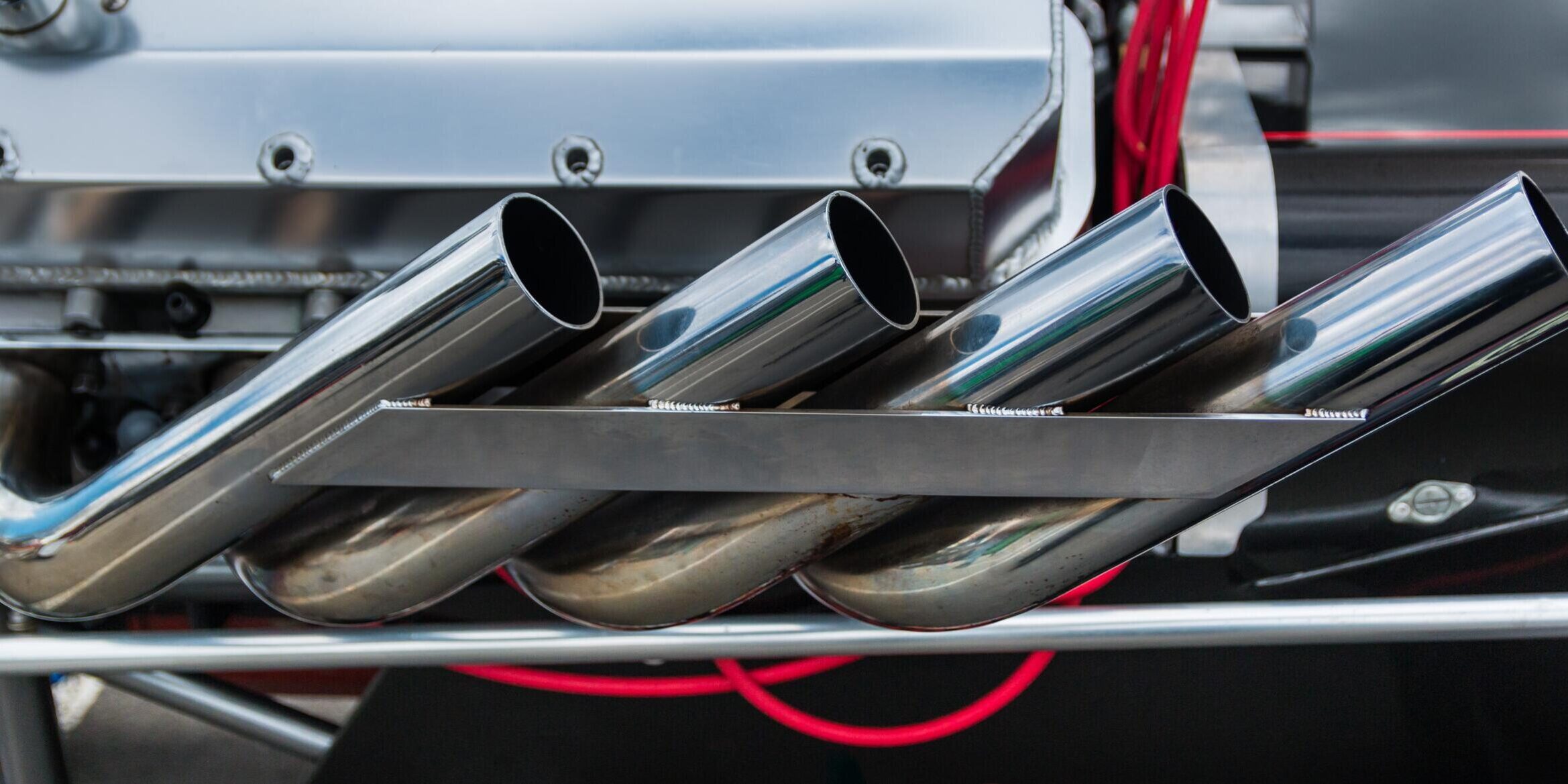 Sweet Manufacturing Signs of a Bad Rack and Pinion Photo 1 A shiny and new dragster exhaust system.