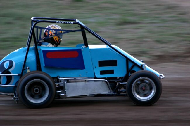 Sweet Manufacturing Sprint Car Racing Blog Photo 1 A blue race car drives down a dirt track.