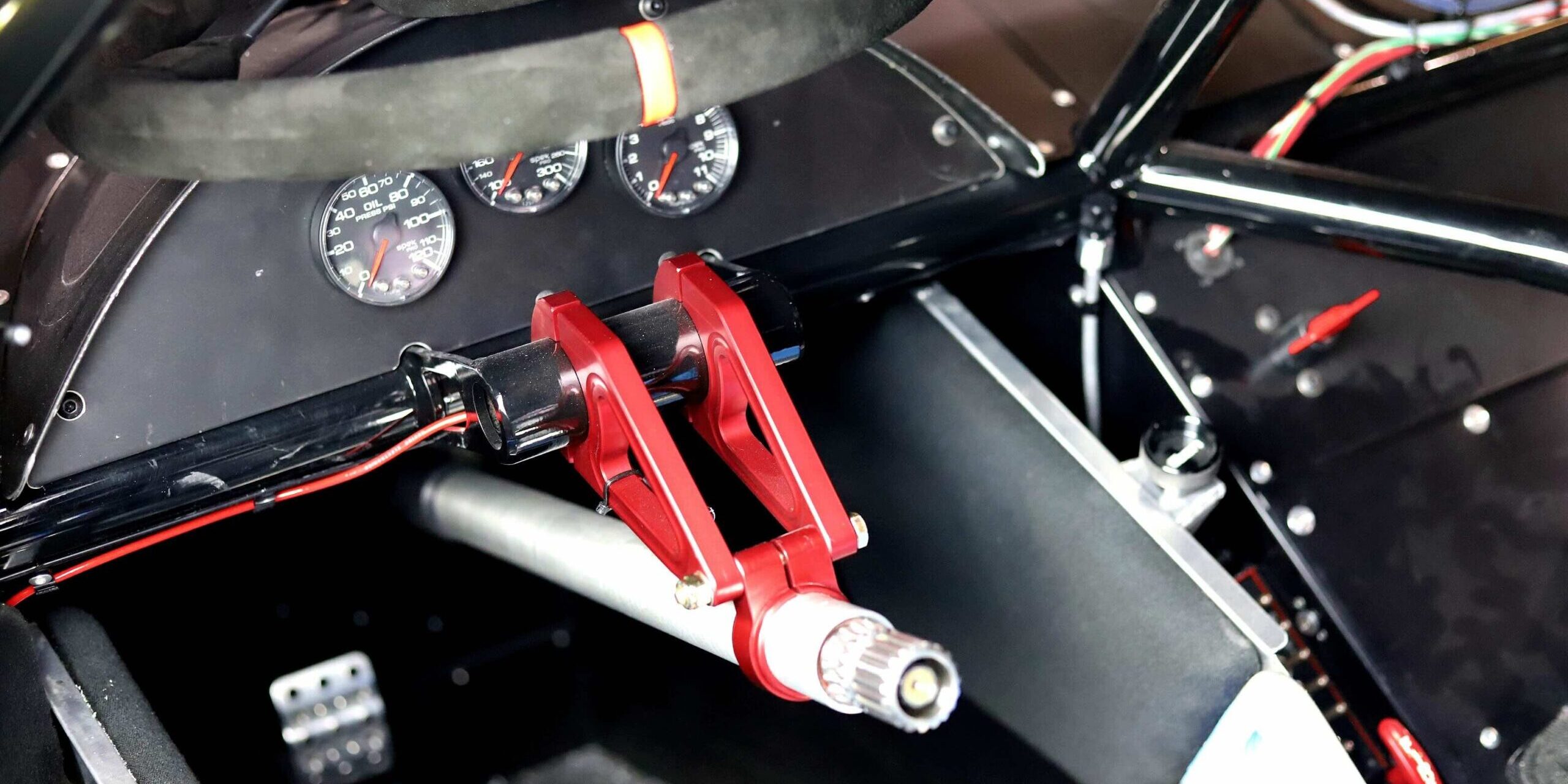 Sweet Manufacturing Types of Steering Wheels Photo 1 Photo of a Sweet Manufacturing quick-release steering wheel in a race car.